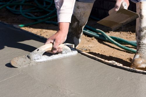 worker finishing a concrete surface